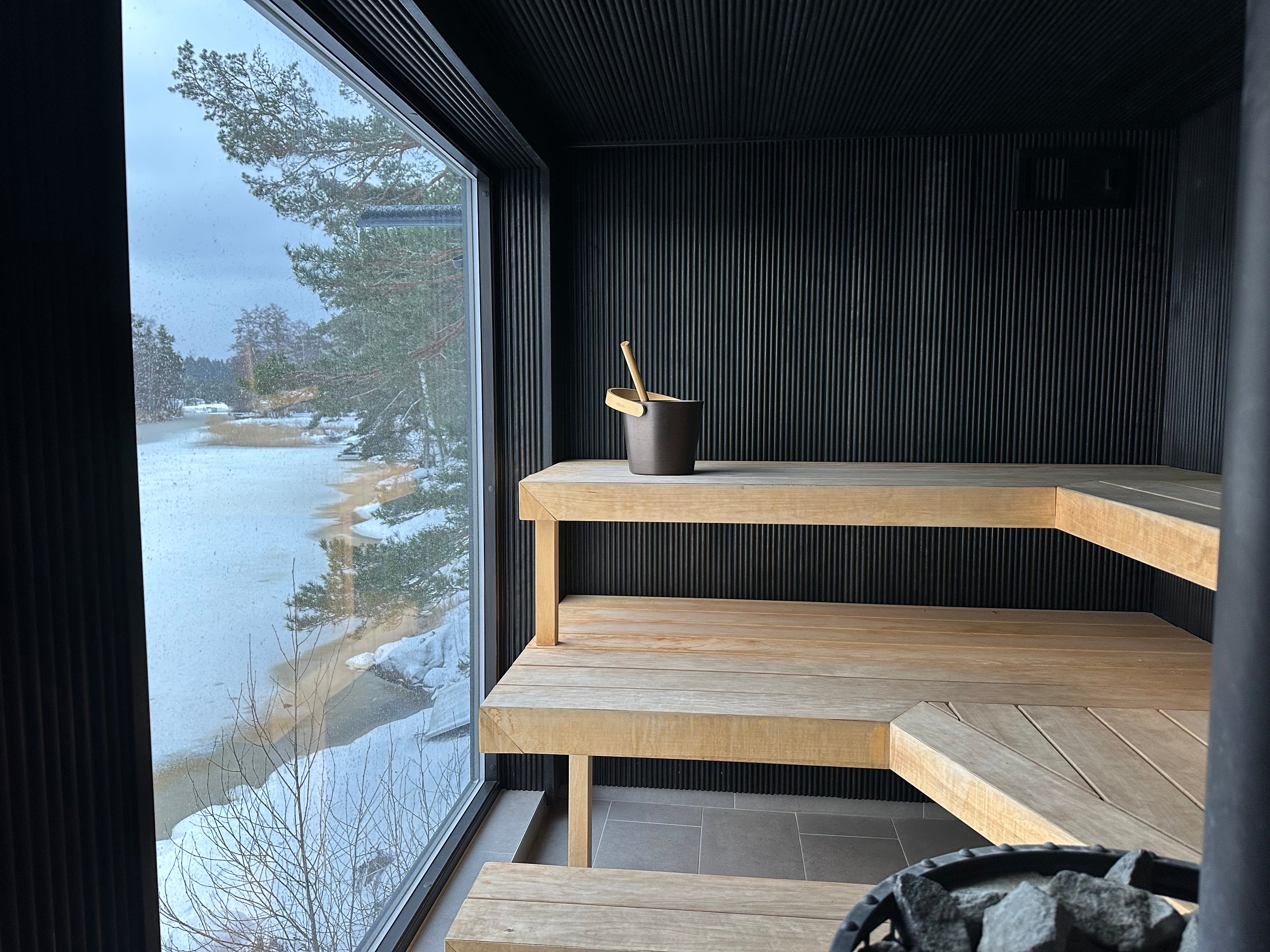 Interior of wood-fired Finnish sauna with panoramic sea view, Stockholm archipelago
